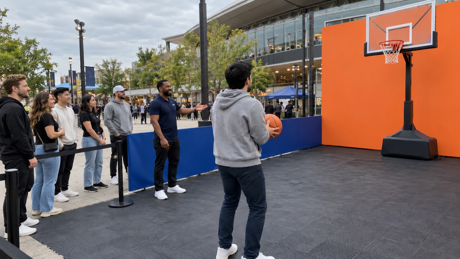 Participant and event host at a small outdoor basketball fan activation