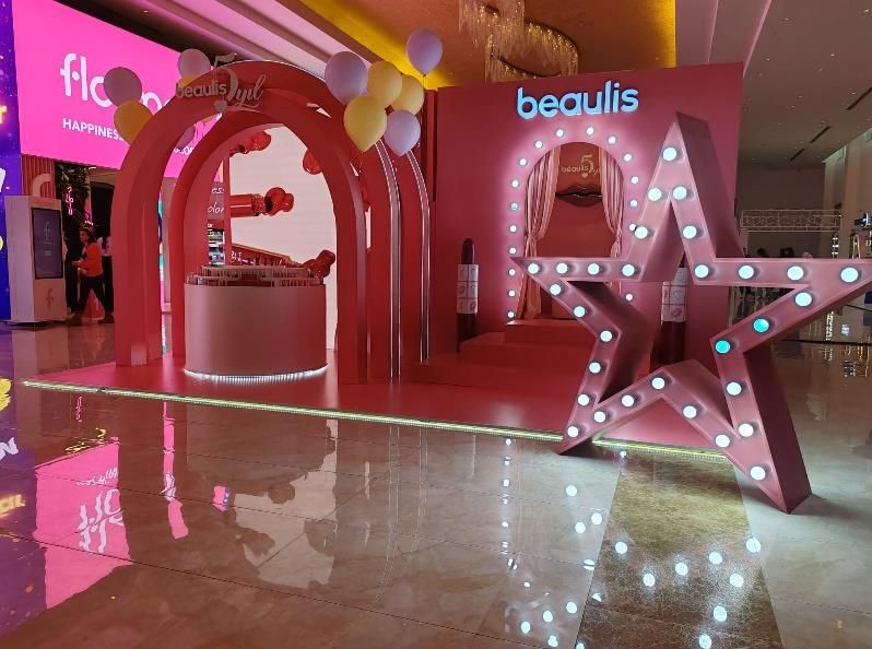 Pink cosmetics promotional space with star-shaped decor
