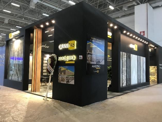 Stone and surface material stand with black walls